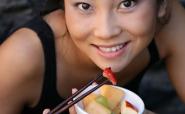 Asian woman eating