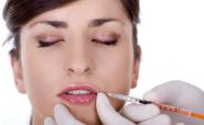 woman getting a botox injection in her lip