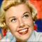 a blonde Doris Day smiling