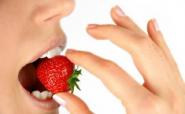 woman eating a strawberry