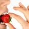 woman eating a strawberry