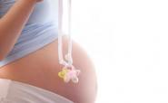 pregnant woman holding a dummy pregnant woman holding a dummy
