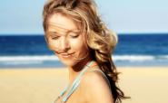 Woman on beach with summer hair look