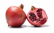 whole and half pomegranate