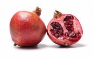 whole and half pomegranate whole and half pomegranate