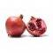 whole and half pomegranate