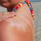 woman applying sunblock on the beach