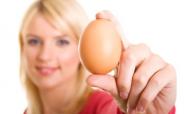 woman holding an egg