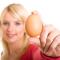 woman holding an egg