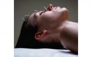 woman receiving facial acupuncture