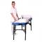 beautician standing next to massage table